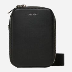 Акція на Сумка планшет чоловіча маленька Calvin Klein K50K512747-BEH Чорна від Rozetka