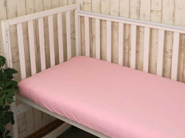 Акція на Детская простынь трикотажная на резинке Руно розовая 60х120 см в кроватку від Podushka