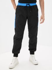 Акция на Спортивные штаны Calvin Klein Jeans Color Block Track Pant J30J318164-BEH L Черные (8719854129912) от Rozetka