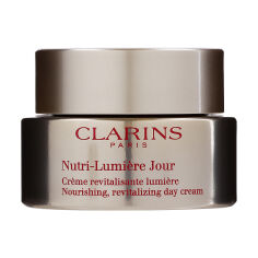 Акция на Денний крем для обличчя Clarins Nutri-Lumiеre Day Cream для всіх типів шкіри, 50 мл от Eva