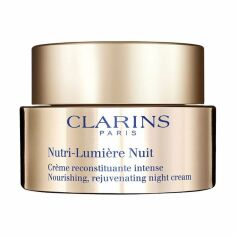 Акція на Нічний омолоджувальний і живильний крем для обличчя Clarins Nutri-Lumiere Nuit Nourishing Rejuvenating Night Cream, 50 мл від Eva