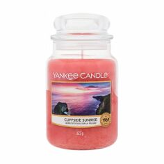 Акція на Ароматична свічка в банці Yankee Candle Cliffside Sunrise, 623 г від Eva