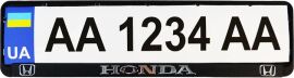 Акція на Рамка номерного знака пластик з об'ємними літерами Inauto Honda 52х13.5х2 см 2 шт (24-005) від Rozetka